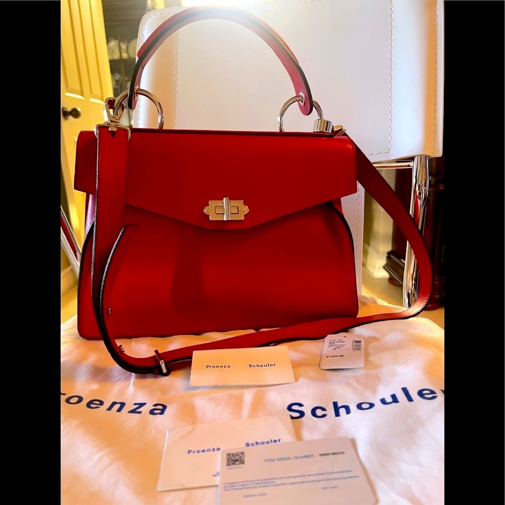 Proenza SchoulerDepth:4.75"
Strap 20"
Width:12.5"
Handle Drop:5.25"
Height:9.75”